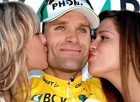 Colombia's Santiago Botero celebrates his overall victory on the podium after winning the 20.4-km individual time trial of the Tour de Romandie ProTour cycling race in Lausanne