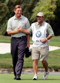 South Africa's Ernie Els clasps hands with his caddie after winning the Asian Open golf tournament in Shanghai. World number three Ernie Els fired a flawless seven-under-par 65 to cruise to a 13-stroke