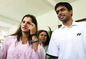 Indian tennis star Sania Mirza and badminton player Gopichand at a function
