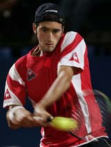 Italy's Potito Starace returns the ball during his tennis match against Spain's Carlos Moya in the first round of the Italian Masters tournament in Rome on Tuesday. Starace won 6-4 7-6. 