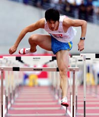 Athens Olympics gold medallist Liu Xiang of China competes in the men�s 110 metres hurdles finals at the IAAF Japan Grand Prix 2005 in Osaka