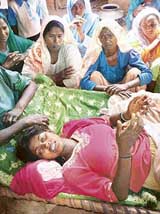 Seventeen-year-old Reshma, allegedly tortured by the Sadar police, with her relatives in Teja Bath village near Devigarh in Patiala on Sunday.