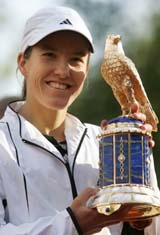 Justine Henin-Hardenne of Belgium holds the German Open Trophy in Berlin