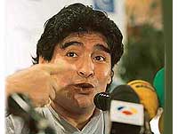 Former football player Diego Maradona of Argentina gestures during a press conference in Madrid on Monday