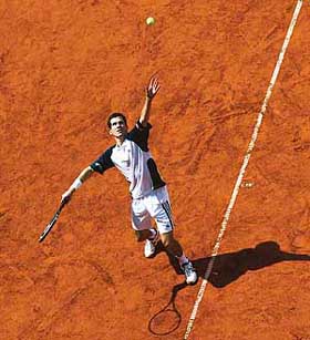 Tim Henman of Great Britain serves to compatriot Greg Rusedski during their match at the Hamburg Masters on Wednesday