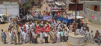 Tenants of government seed farm colonies and their family members take out a protest march at Abohar