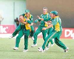 Members of the South African team celebrate after beating the West Indies by one run in the third one-day international cricket match at Kensington Oval in Bridgetown, Barbados, on Wednesday. 