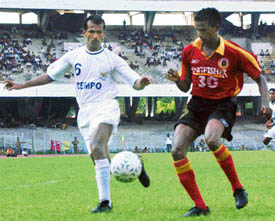 East Bengal�s Climax Lawrence (right) and Dempo�s Mario Soares fight for the ball during a National Football League match at Salt Lake Stadium in Kolkata on Monday. 