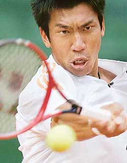 Paradorn Srichaphan of Thailand makes a return to Christophe Rochus of Belgium during their match at the International Grand Prix at St Polten in Austria on Tuesday