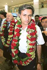 Chelsea manager Jose Mourinho arrives at the airport in Inchon, west of Seoul