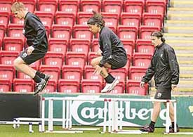 Igor Biscan, Milan Baros and Gonzalez Josemi go through their paces during training at Liverpool 