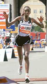 Florence Barsosio of Kenya crosses the finish line at the 22nd Vienna City Marathon in Vienna on Sunday