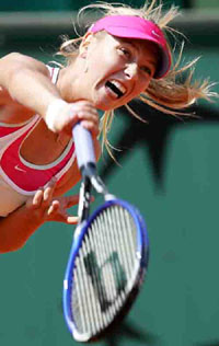 Russia's Maria Sharapova serves to compatriot Anna Chakvetadze during their third round match of the French Open