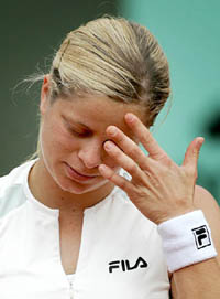Fourteen seed Belgium's Kim Clijsters reacts after losing her match against Lindsay Davenport
