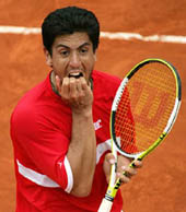 Guillermo Canas reacts after losing his quarterfinal match against compatriot Mariano Puerta in the French Open at Roland Garros on Wednesday. Puerta won 6-2, 3-6, 1-6, 6-3, 6-4.