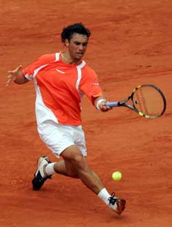 Argentina�s Mariano Puerta hits a forehand to Russia�s Nikolay Davydenko during their semifinal at the French Open in Paris on Friday