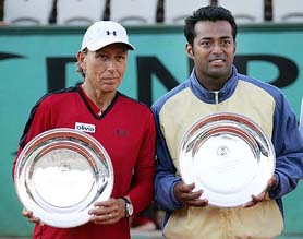 India�s Leander Paes and the USA�s Martina Navratilova with the runners-up trophy after losing the French Open mixed double final against France�s Fabrice Santoro and Slovak Republic�s Daniela Hantuchova in Paris on Friday. Santoro and Hantuchova won 3-6, 6-3, 6-2