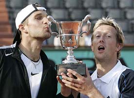 Sweden�s Jonas Bjorkman and Belarus� Max Mirnyi hold the trophy after defeating the USA�s Mike Bryan and Bob Bryan in the men�s doubles final at the French Open in Paris on Saturday
