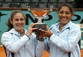 Spain�s Virginia Ruano Pascual  and Argentina�s Paola Suarez hold the trophy after winning the women�s doubles final at the French Open in Paris on Sunday
