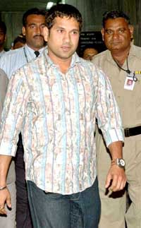 Sachin Tendulkar arrives at the Mumbai airport on Monday after an operation in London