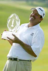 Bart Bryant holds the trophy after winning the Memorial Tournament at the Muirfield Village Golf Club in Dublin, Ohio, on Sunday