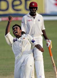 Pakistani leg-spinner Danish Kaneria exults after taking the wicket of West Indies� batsman Devon Smith during the fourth day�s play of the second Test at Sabina Park in Kingston