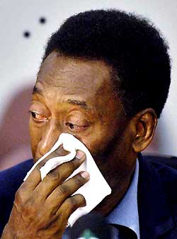 Soccer legend Edson Arantes do Nascimento, better known as Pele, cries during a press conference at a police station in Sao Paulo on Tuesday