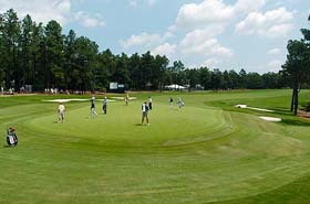 A group of golfers practise on the fifth hole of the Pinehurst No. 2 course during a practice round for the US Open, which will begin on Thursday, in North Carolina on Tuesday