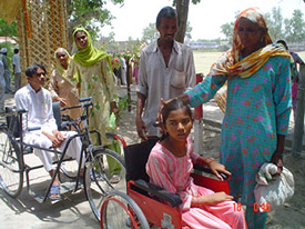 Physically challenged children coming out of Viklang Sahayata Camp with their relatives.