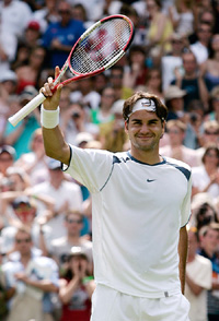 Top seed Swiss tennis star Roger Federer celebrates his first round victory over  Paul-Henri Mathieu of France at Wimbledon on Monday