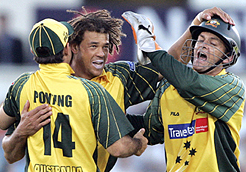 Australia�s Ricky Ponting (left) and Adam Gilchrist (right) congratulate Andrew Symonds for taking the wicket of England�s Kevin Pietersen during their one-day match at Chester-le-Street, northern England.