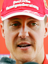 German Formula One driver Michael Schumacher speaks to journalists during the second day of testing of new mechanical components and aerodynamics at the Circuit de Catalunya race track, near Barcelona