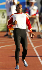Marion Jones warms up before the start of her heat in the women�s 100m dash during the US championships at Home Depot Centre in Carson, California