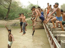 Children diving in the Bathinda branch of the Sirhind canal to beat the heat on a hot day in Bathinda.