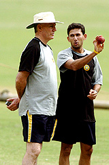 Indian speedster Ajit Agarkar talks to coach Greg Chappell during a conditioning camp in Bangalore on Tuesday