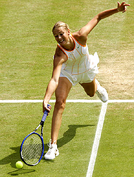 Russia's Maria Sharapova plays a shot to compatriot Nadia Petrova in their quarterfinal match at Wimbledon on Tuesday