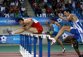 Felipe Vivancos of Spain runs ahead of Andrea Giaconi of Italy and Juraj Grabusic of Croatia in the men�s 110m hurdles final at the 15th Mediterranean Games in Almeria, Spain, on Wednesday