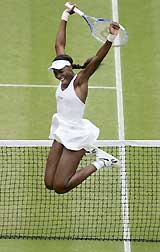 US tennis star Venus Williams celebrates her win over Maria Sharapova of Russia in the semifinal at Wimbledon on Thursday