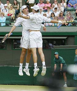Bob and Mike Bryan of the US celebrate after taking a point