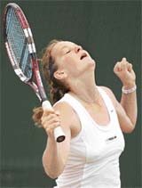 Poland�s Agnieszka Radwanska celebrates after winning the girls singles final against Austria�s Tamira Paszek at Wimbledon in London on Saturday