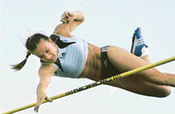 Olympic champion Yelena Isinbayeva of Russia clears the bar in the pole vault event to set a new world record at the IAAF Super Grand Prix in Lausanne, Switzerland, on Tuesday