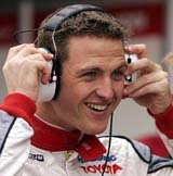 Toyota�s Formula One driver Ralf Schumacher of Germany adjusts his headphones during a practice session for the British Grand Prix at the Silverstone race track in Northamptonshire, England, on Friday