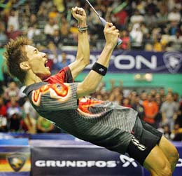 Malaysia�s Lee Chong Wei celebrates after winning the men�s single title at the Malaysian Open 2005 badminton championship in Kuala Lumpur on Sunday. Lee defeated China�s Lin Dan 17-15, 9-15, 15-9.
