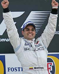 Colombian Juan Pablo Montoya of McLaren- Mercedes celebrates after winning the British Grand Prix at the Silverstone race track in Northamptonshire, central England, on Sunday.