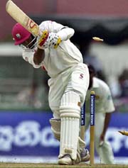 Tino Best of the West Indies is bowled by Chaminda Vaas of Sri Lanka during the second day�s play of the first Test in Colombo 