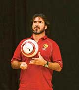 Former Manchester United forward Eric Cantona plays with a ball during a Manchester United soccer school event in Hong Kong on Wednesday. 