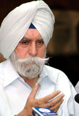 Indian Hockey Federation President K.P.S. Gill addresses a press conference in New Delhi on Thursday