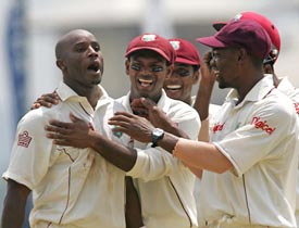 West Indies bowler Tino Best  is congratulated by team-mates after the dismissal of Sri Lankan batsman Mahela Jayawardene on the first day of the second Test in Kandy on Friday