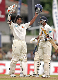 Sri Lankan batsman Kumar Sangakkara celebrates on reaching his century 