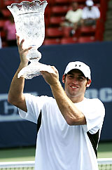 Robby Ginepri of the USA lifts the trophy after winning the RCA Championship in Indianapolis on Sunday